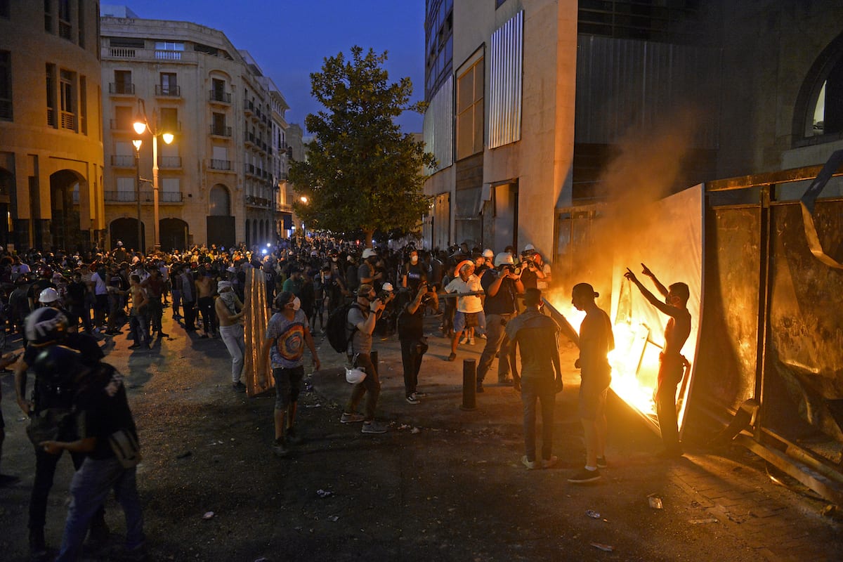 BEIRUT, LEBANON – AUGUST 11: Lebanese demonstrators try to break ...