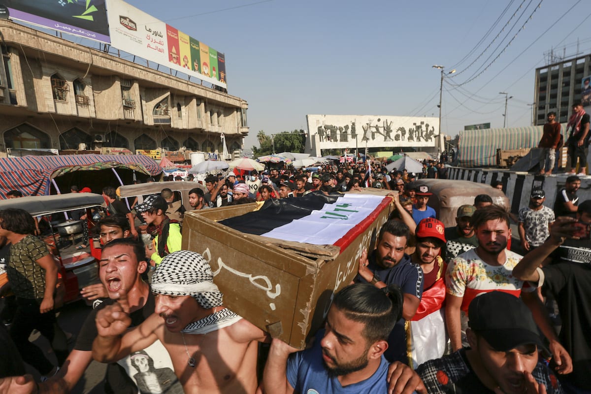 BAGHDAD, IRAQ – OCTOBER 26: Iraqi people carry the coffin of a ...