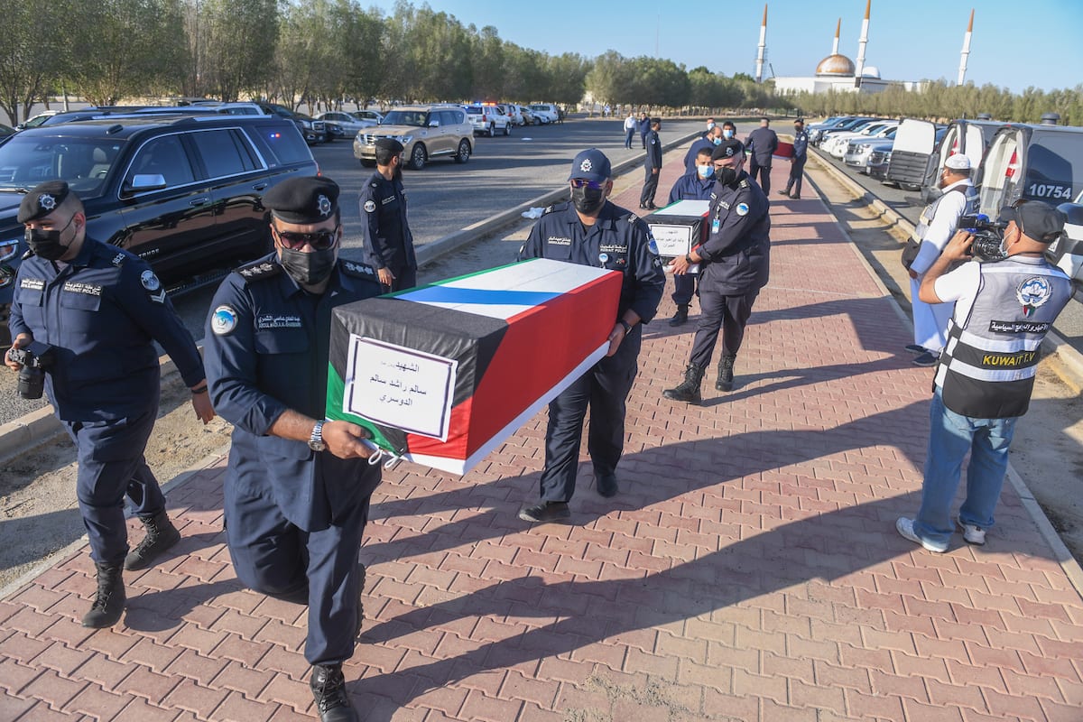 KUWAIT CITY, KUWAIT – NOVEMBER 23: Kuwaiti security forces carry the ...