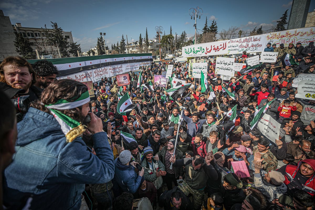 IDLIB, SYRIA – FEBRUARY 19: Syrian Civilians Holding Banners And Flags ...