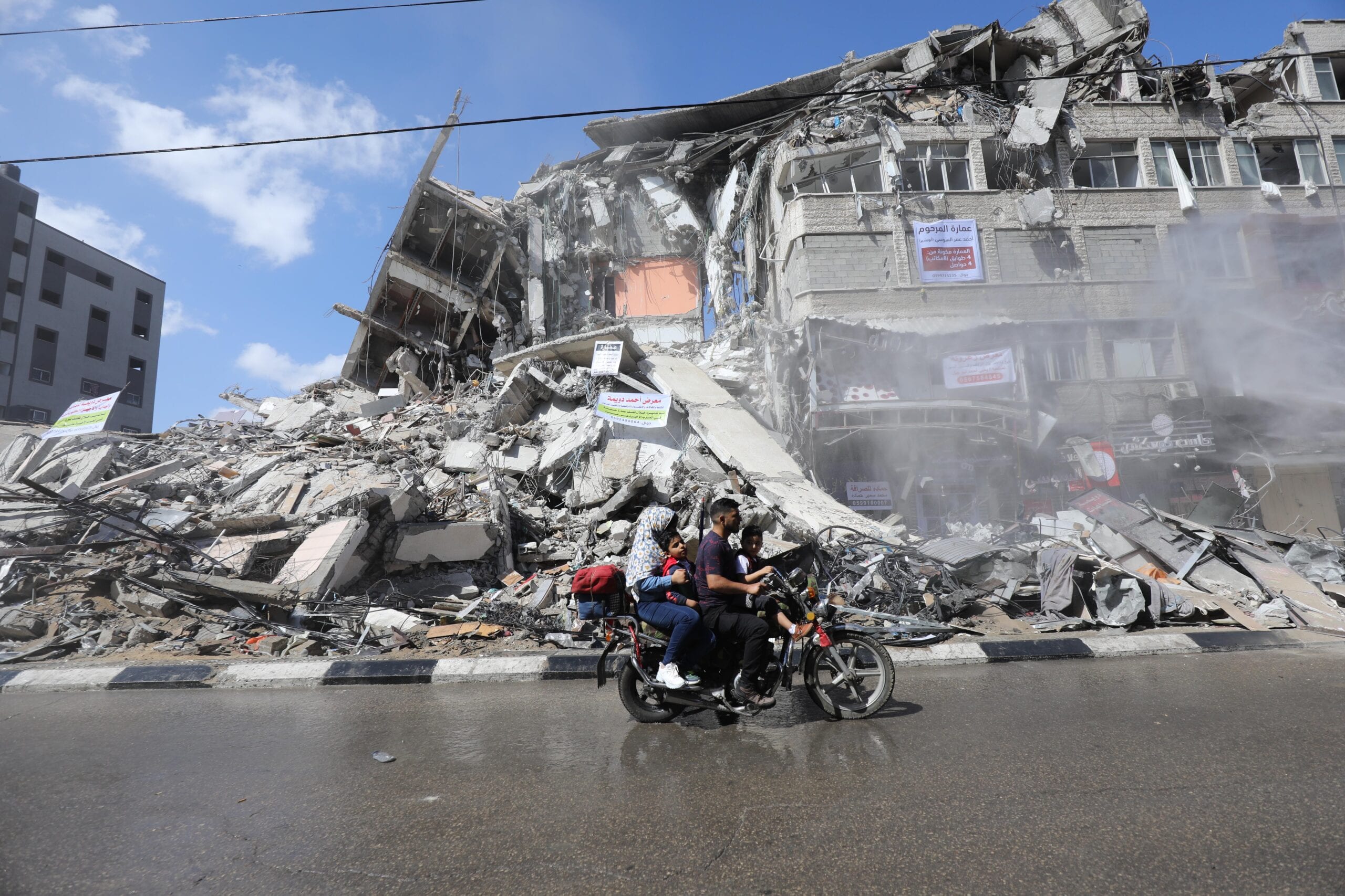 Palestinian Volunteers Sweep The Rubble Of Buildings Destroyed By 