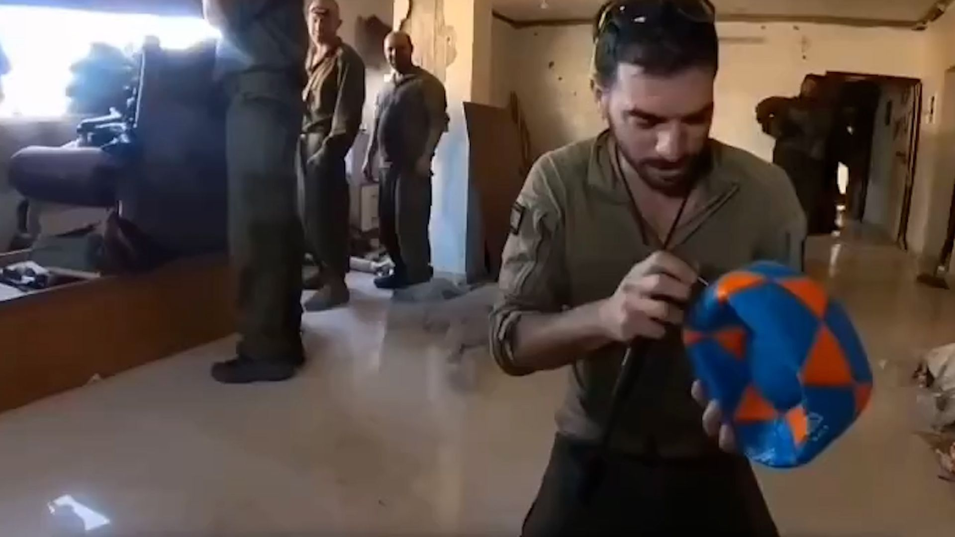 israeli-soldiers-play-with-ball-in-a-destroyed-palestinian-home